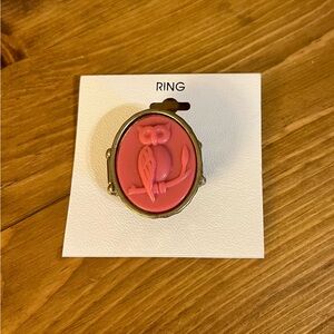 Pink owl stretch ring on a gold tone frame with stretchy size 6 to very large